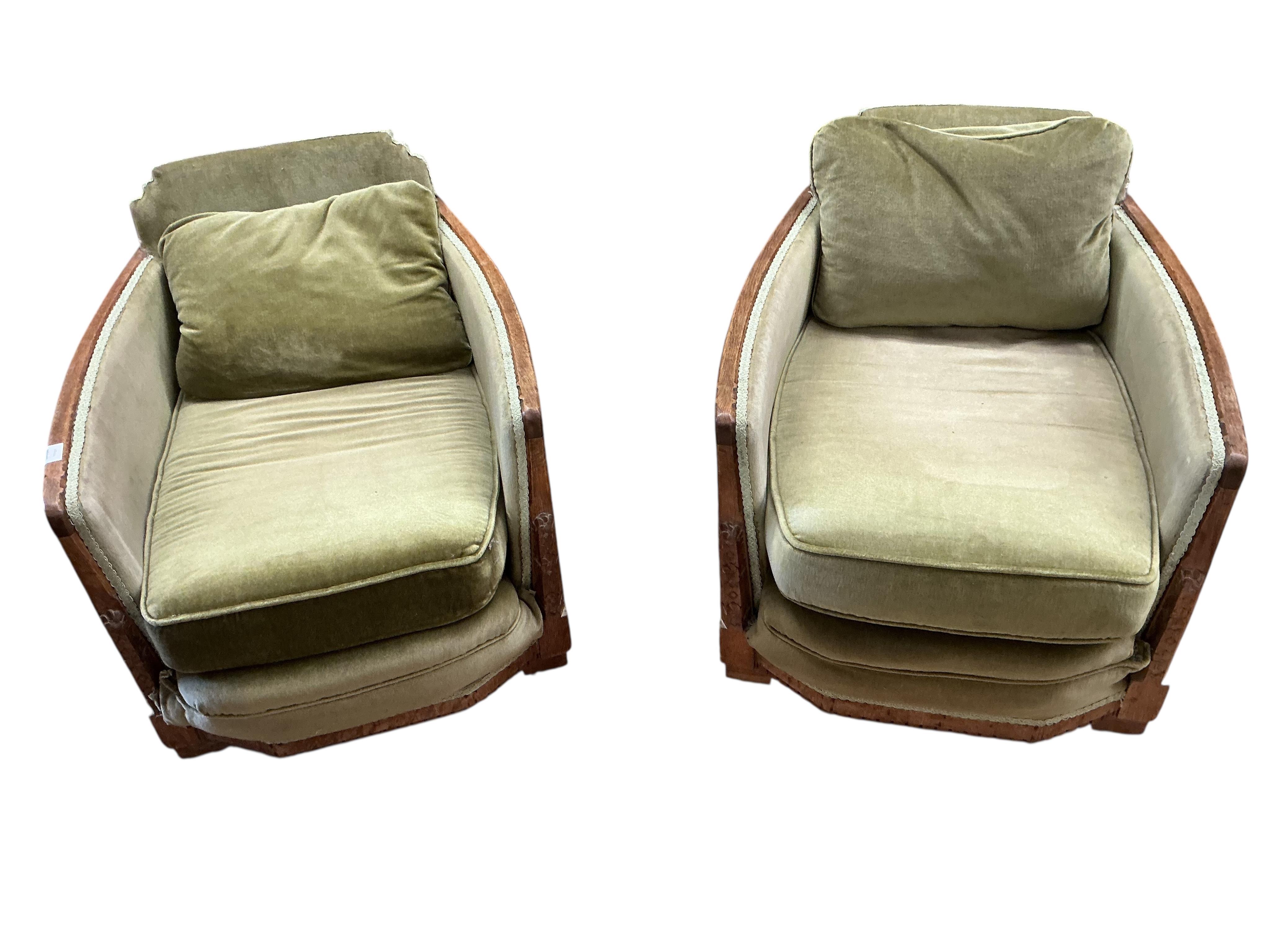 A pair of French Art Deco oak armchairs, width 69cm, depth 90cm, height 69cm